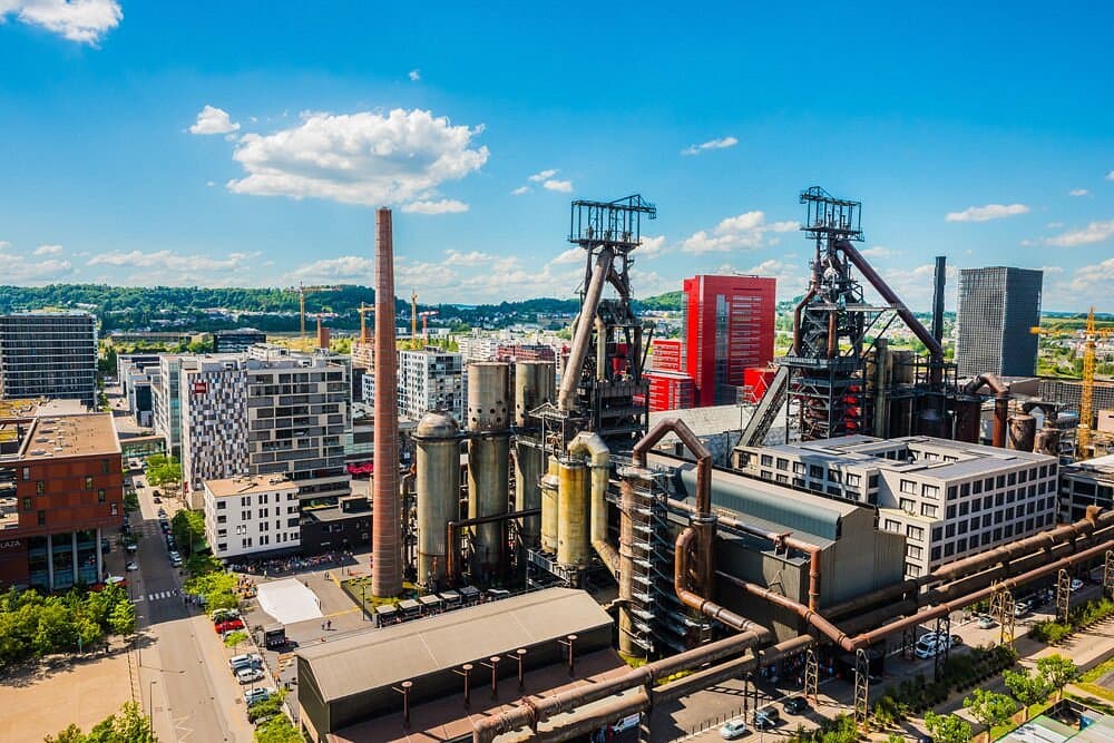 Aerial view of Belval's preserved blast furnaces amid the modern Cité des Sciences in Luxembourg